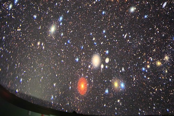 Speaker showing astronomical images on dome