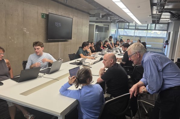 Researchers sitting at table